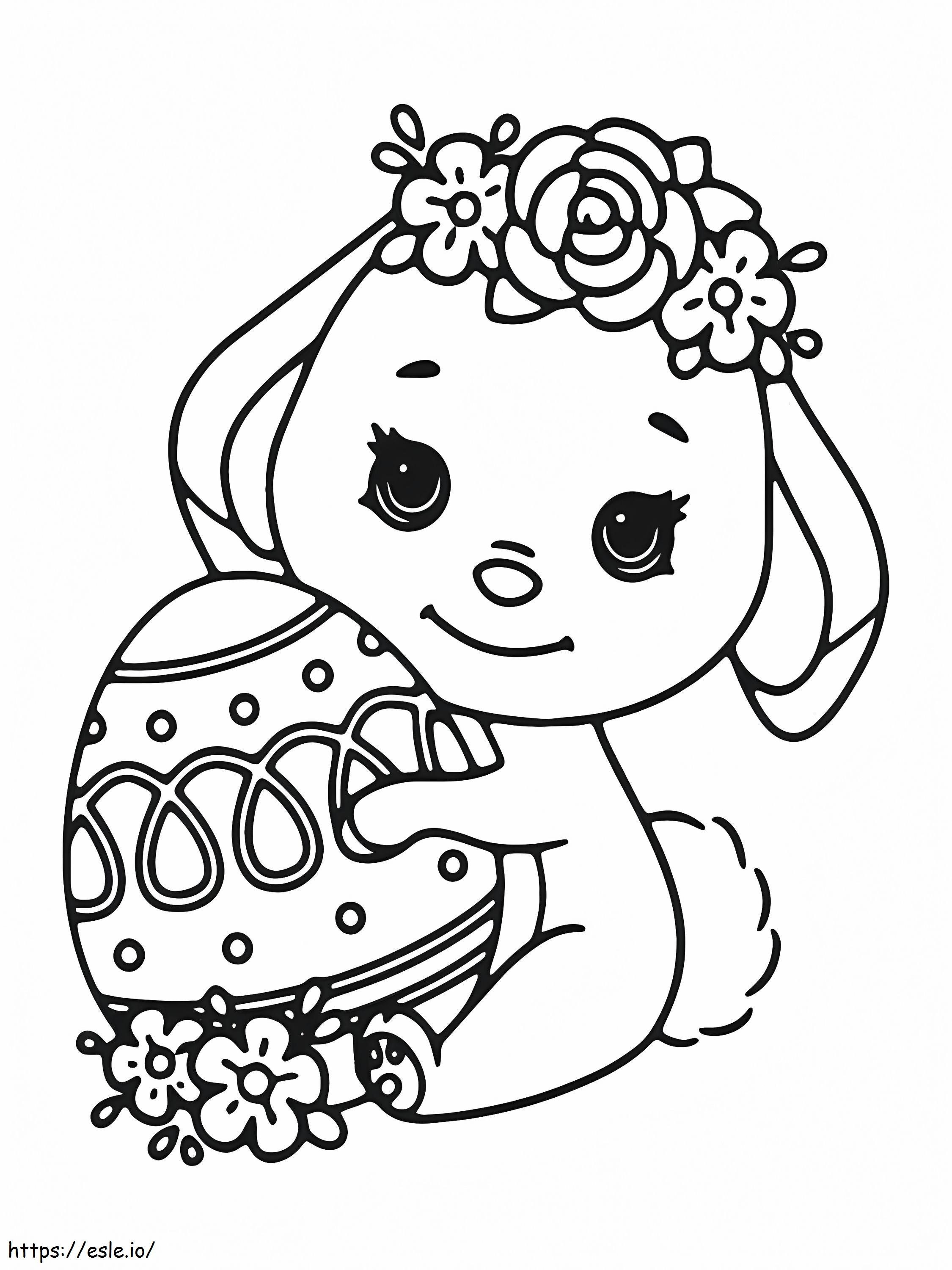 Coloriage Petit lapin de Pâques tenant un oeuf à imprimer dessin