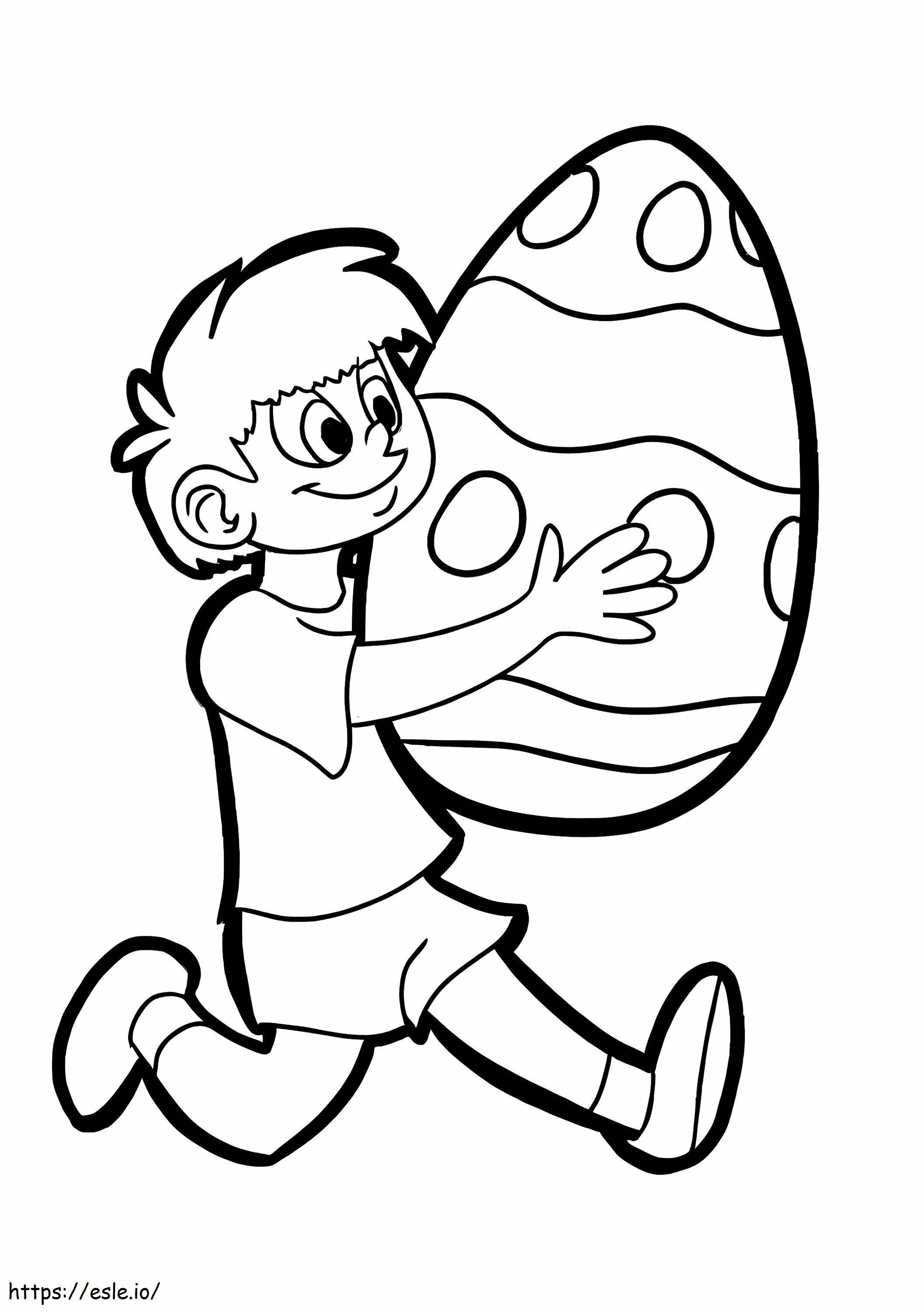 Băiat ținând ou de Paște de colorat