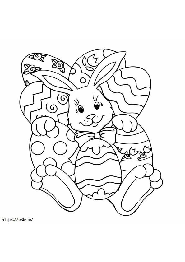 Coniglietto sdraiato con le uova di Pasqua da colorare