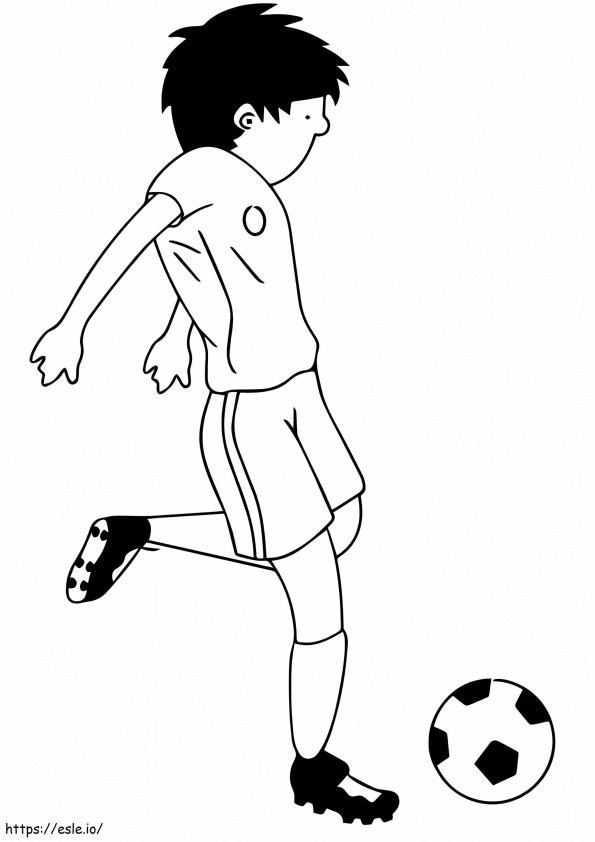 Coloriage Un garçon jouant au football à imprimer dessin